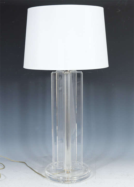 A single vintage table lamp composed of clear lucite. The piece has a circular base and five lucite planks around a central chrome bar.

Reduced From: $650

7949