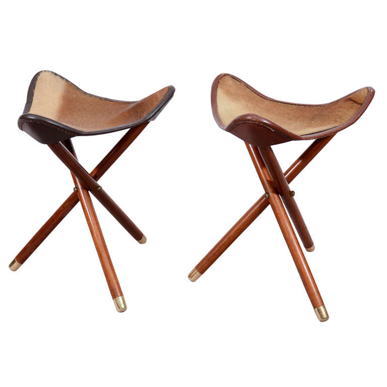 A Pair of Mid Century Teak and Hide Tripod Folding Stools at 1stDibs