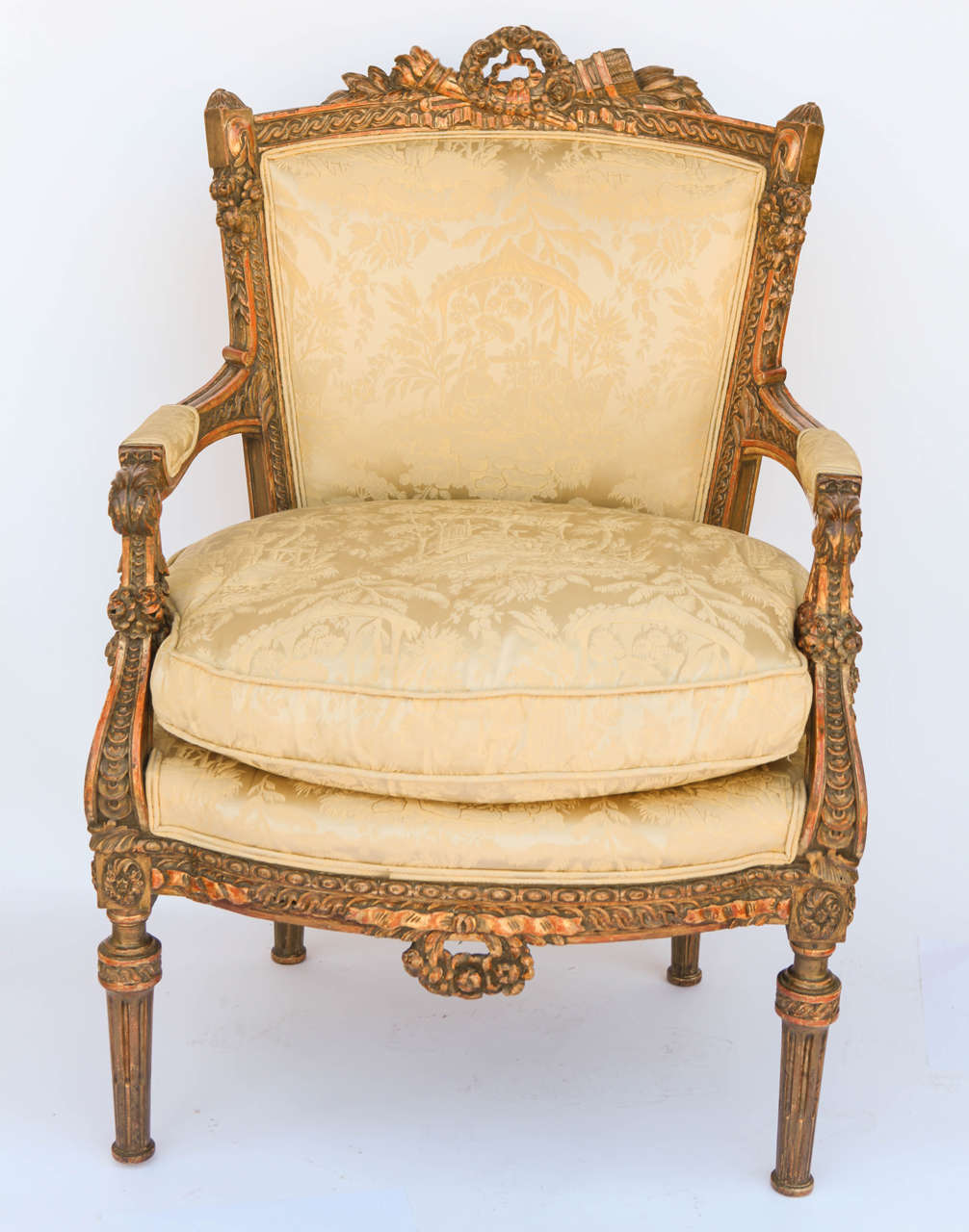 A pair of very fine 19th century French walnut armchairs upholstered in silk damask.