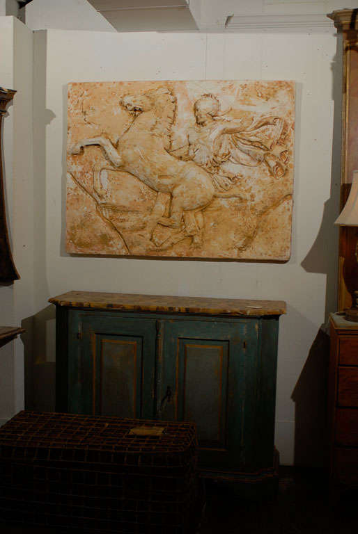 A plaster wall decoration depicting a rider with his horse by Harold Studio from the 1950s.

 