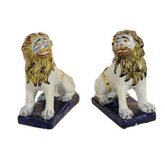 A Pair of Polychrome  Faience LIons