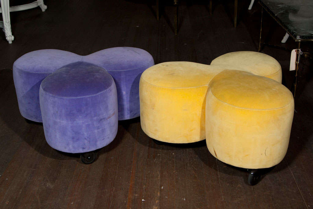 Outlandish French pouf in yellow velvet.  It is on casters.