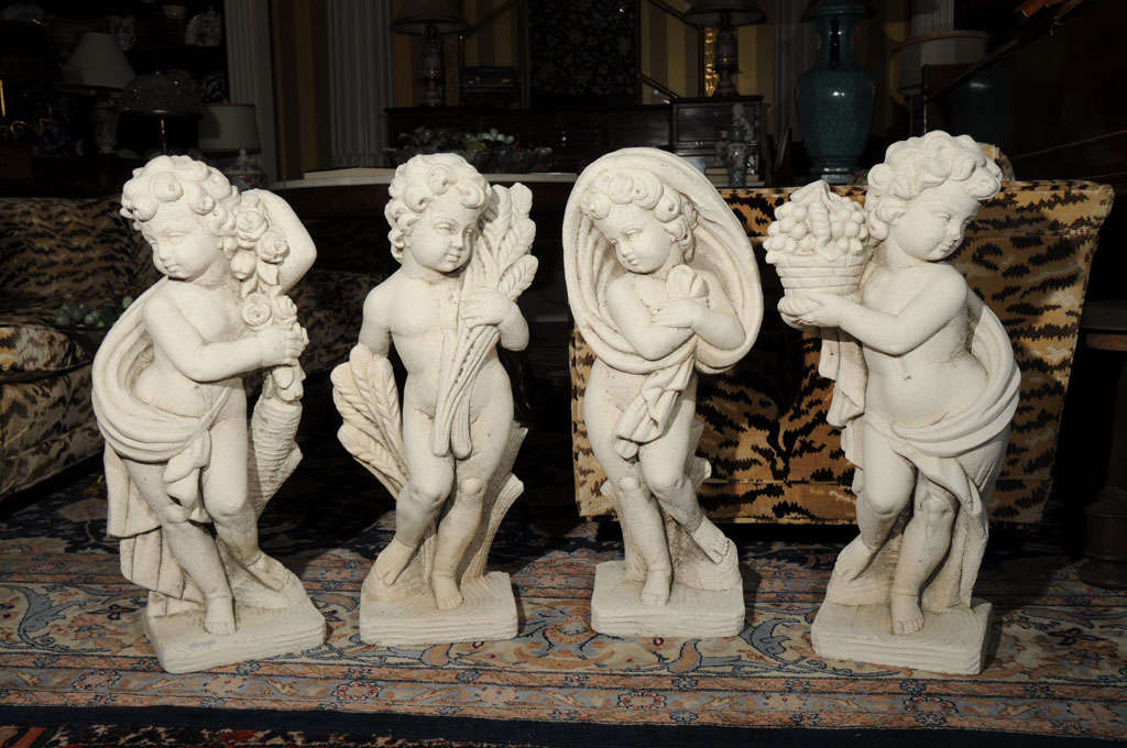 Set of cast stone, garden, cherub statuary of the four seasons