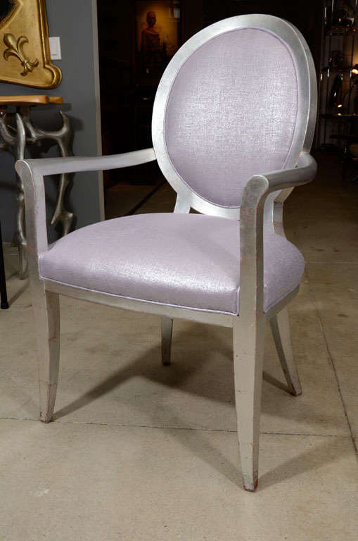 A glamorous pair of silvered wood Louis XVI style fauteuils covered in a fabulous glimmering violet glazed linen.