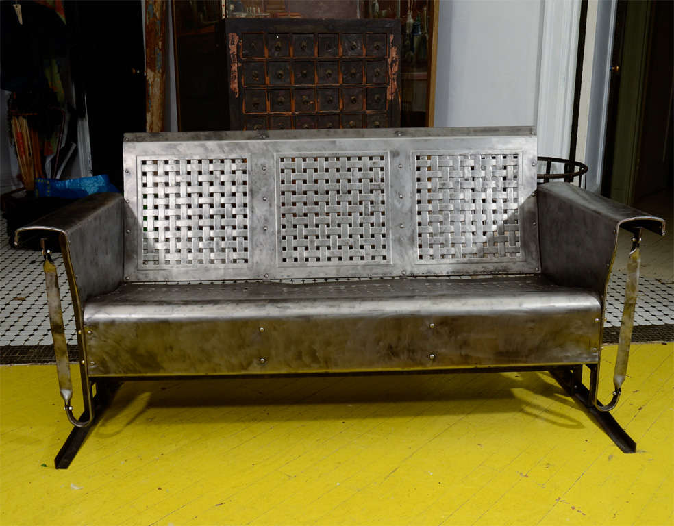 Pennsylvania Bunting Glider Company waffle weave metal gliding sofa.<br />
Heights - Back: 32