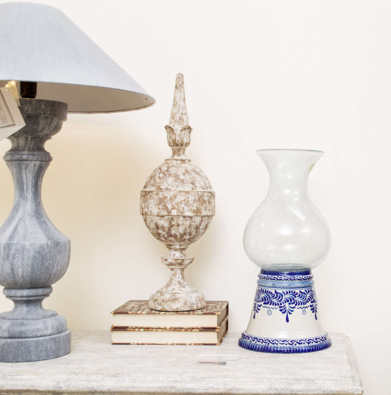 A pair of talavera hurricane lamps in blue and white design for candles