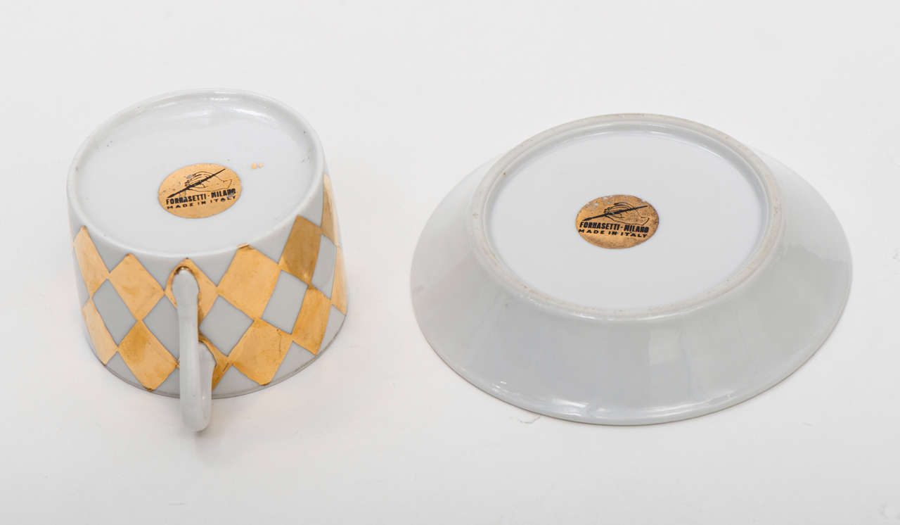 A set of six Coffee Cups and Saucers by Piero Fornasetti.