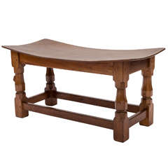 A Robert “Mouseman” Thompson Oak Double Dish stool.