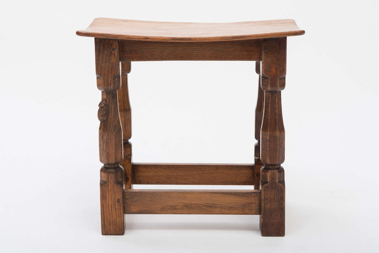 A Robert “Mouseman” Thompson Oak Dish Top Stool.