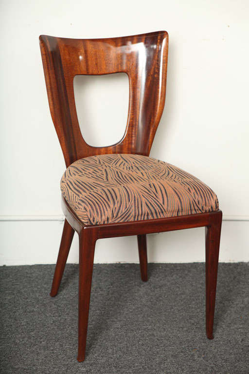 SET OF 8 EXQUISITE MAHOGANY DINING CHAIRS MADE IN MILAN 1940, DESIGNED BY GUGLIELMO ULRICH. GRACEFUL CARVED BACK WITH FRONT LEGS TAPERING TO A PAW FOOT RARE.