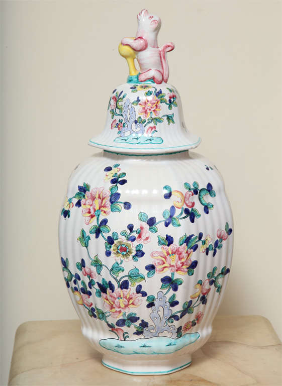 A Hand Painted Faience Covered Vase with Foo-Dog Finial