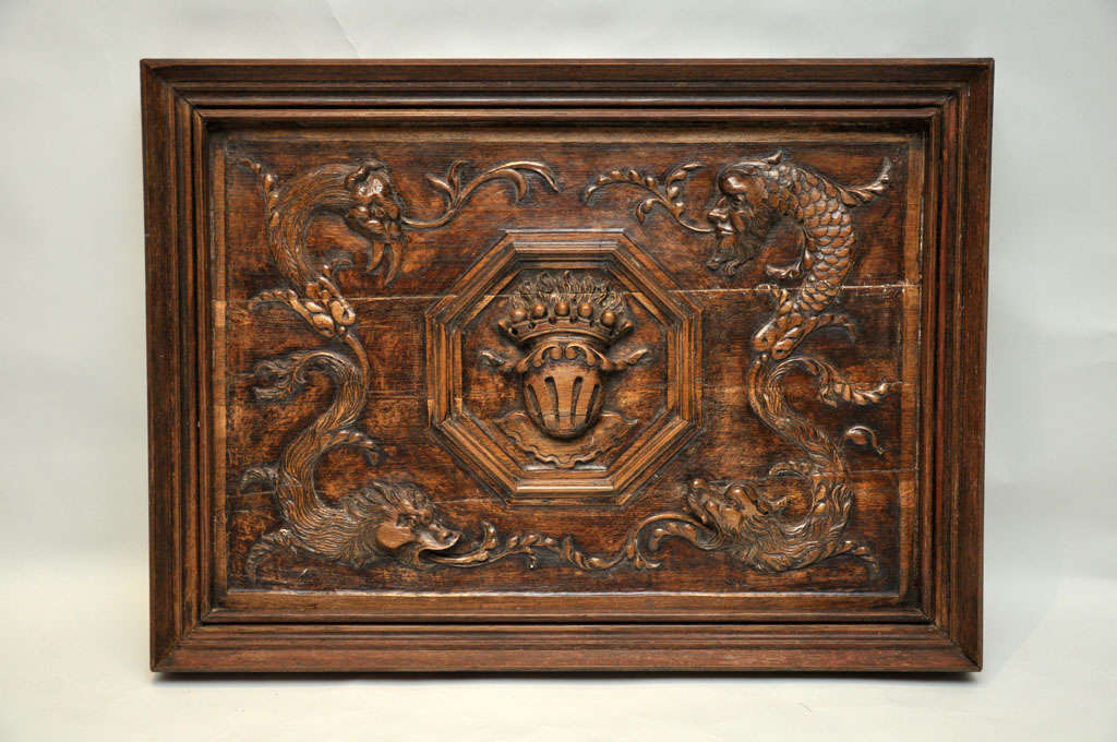 One-of-a-kind French rectangular framed hand-carved plaque, depicting a family crest in the center of an octagon shape, flanked on either side with mythological creatures, framed with a rectangular shaped border.