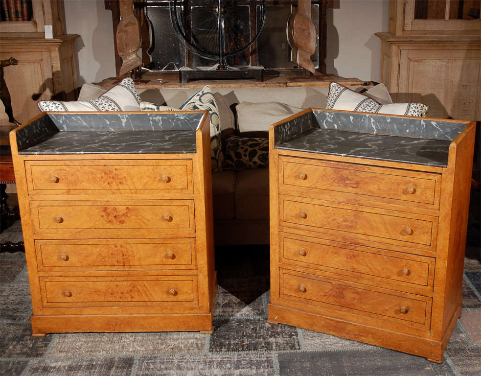 Late 19th century pair of Swedish faux Marble-Top chest of drawers. The chests of drawers has been made to accentuate the natural grain of the wood. Each wood grain chest has four drawers.

They each measure 17 x 30 x 36
