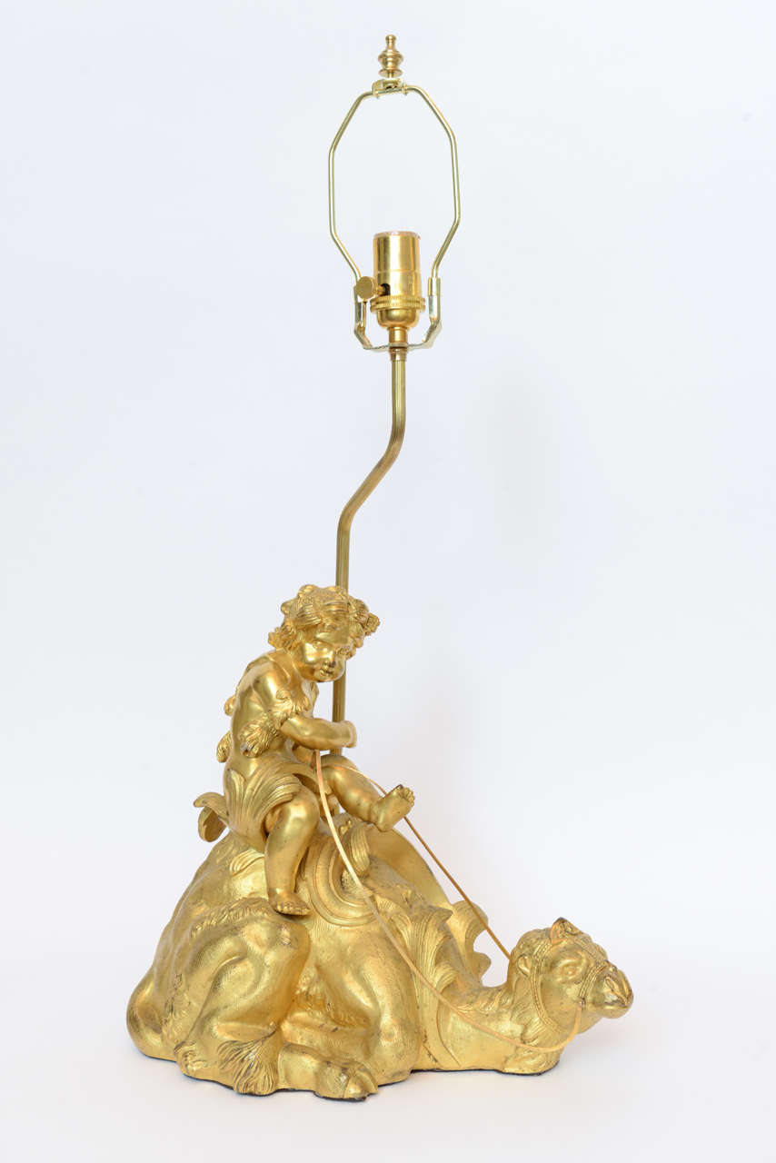 Ormolu French Orientalist Gilt Bronze Lamps with Cupids Riding Camels For Sale