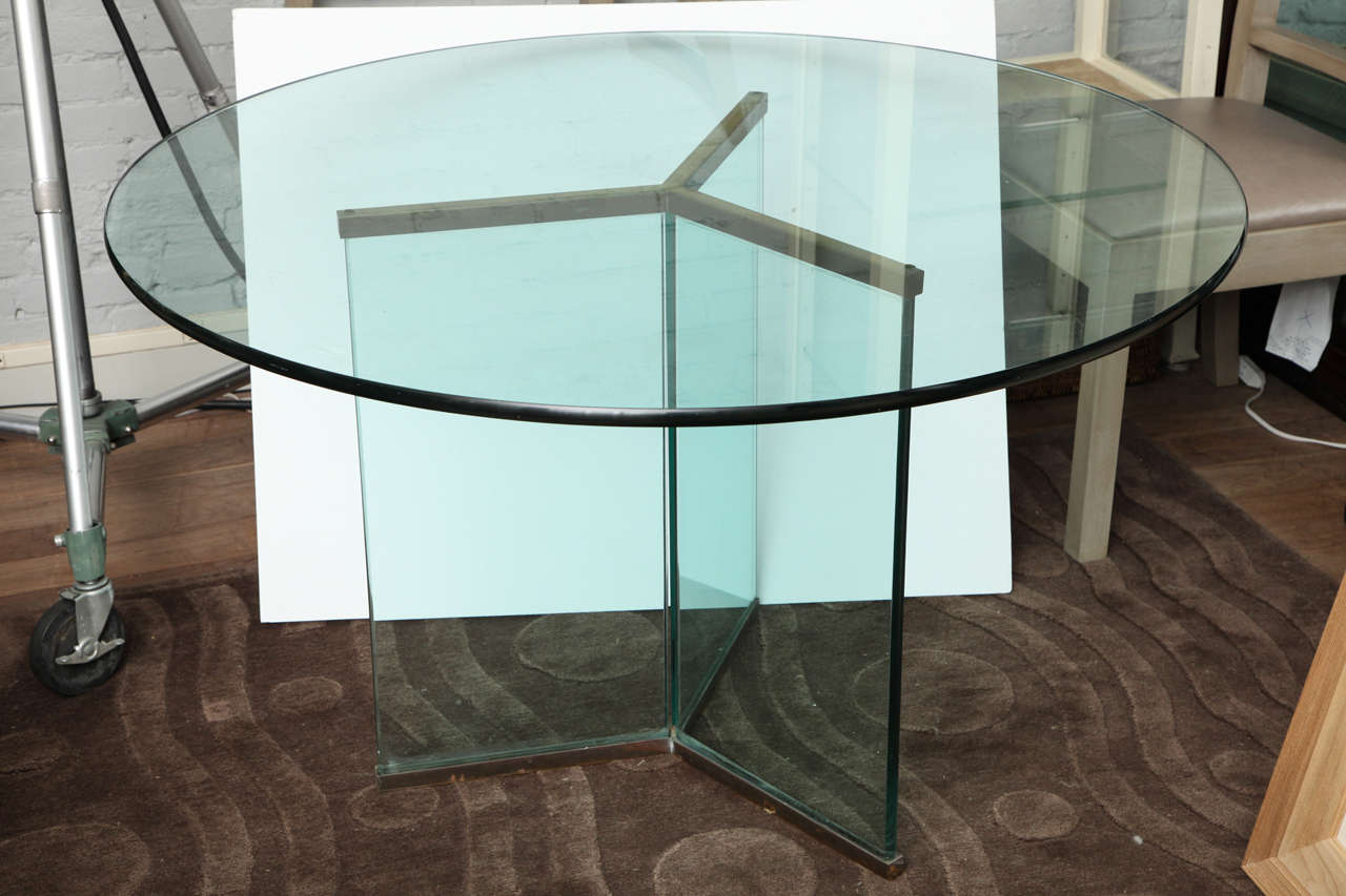 Glass and brass dining table with delta-form base by Leon Rosen for Pace, circa 1970 in original condition.