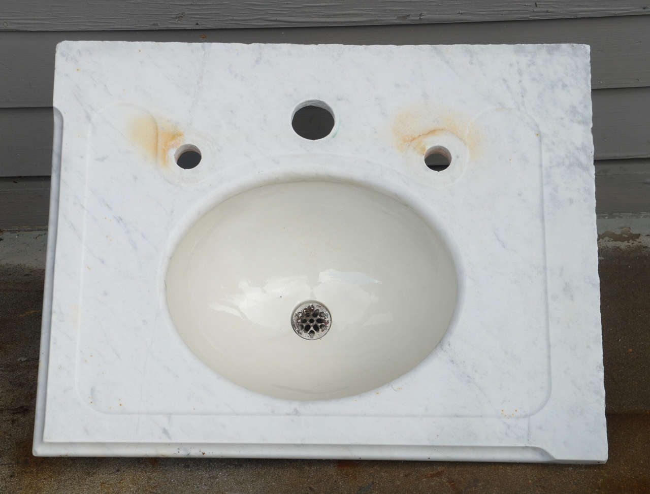 Vintage marble vanity sink top with newly drilled holes to accommodate modern fixtures.  Some rust stains.