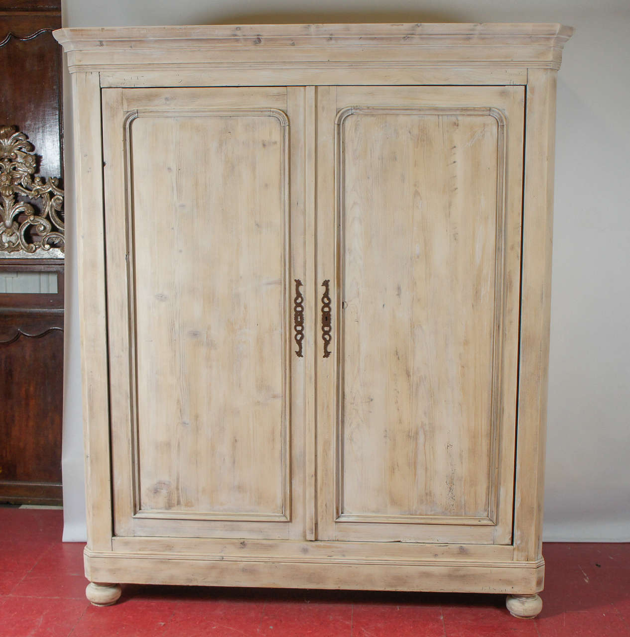 19th century European painted pine wardrobe with pocket doors. Cabinet is white washed. Large interior space for ample storage.  Crown molding depth = 24