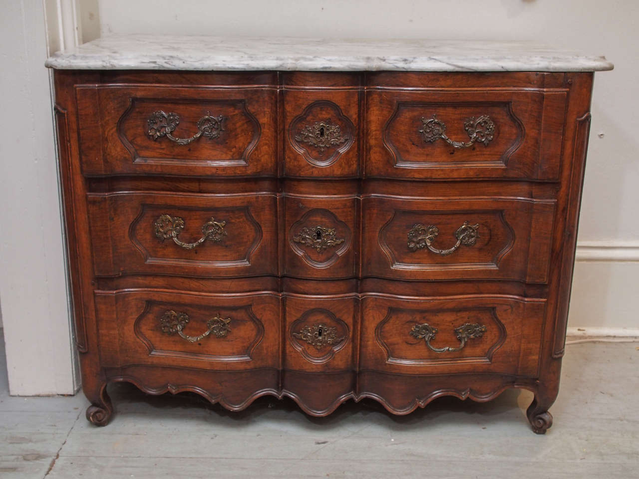 Serpentine Front and Carved Walnut Louis XV French Commode.