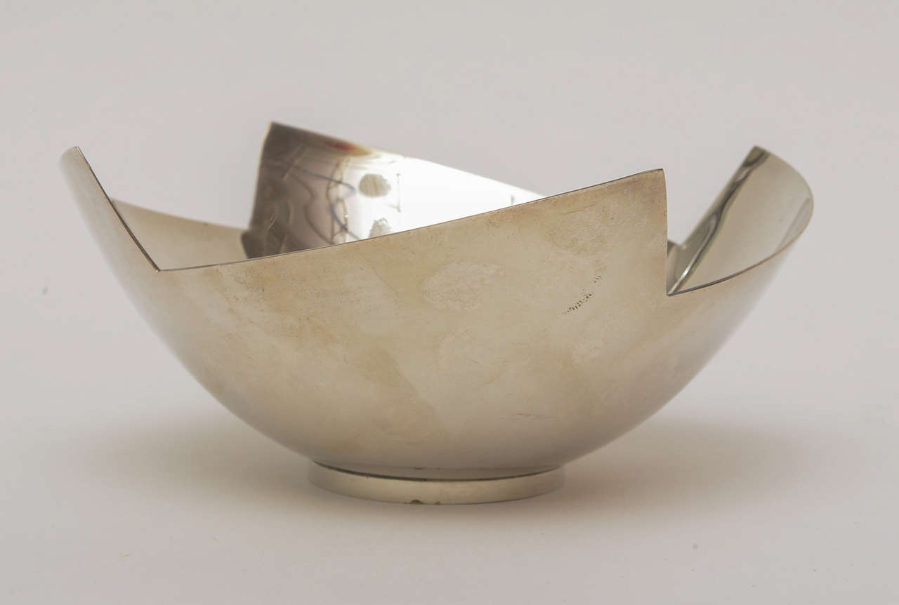 The organic and very sculptural shape of this signed silver plate bowl for Swid Powell came from her work and line of ceramics. This form echoes the earthy but modern work she has done.
It is simple and modern and oh so timeless.