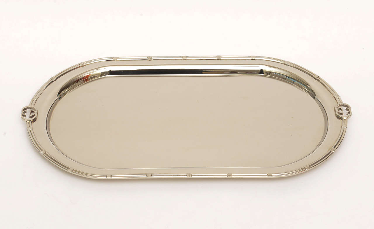 This needs little words or descriptions... classic, fabulous, forever is this vintage 
luxury signed Gucci oval serving or decorative tray. It has the placed lined notches around the tray! It is signed on the underside of the G