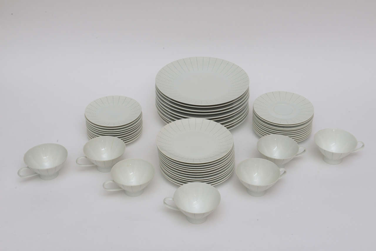 This subtle but beautiful pattern of porcelain is called Regina designed by Raymond Loewy for Rosenthal. On the back of each serving piece is marked shape classic modern.
The white porcelain's pattern is only on the outer rim area it is blue gray
