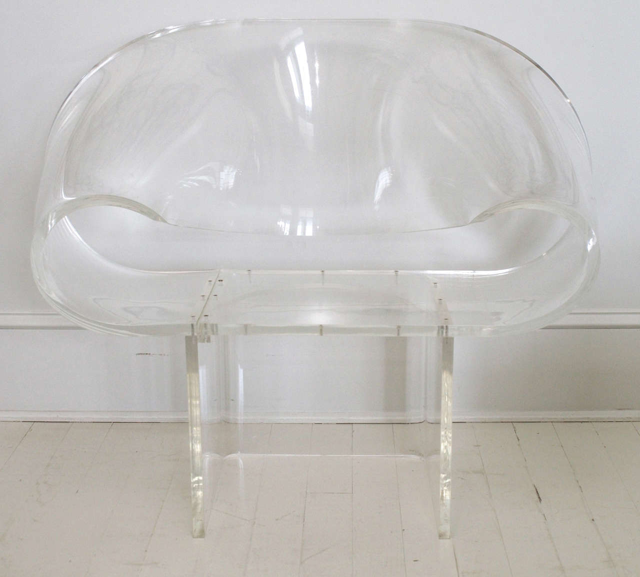 This mid-century modern lucite armchair is quite the statement piece.  Constructed of 3/4