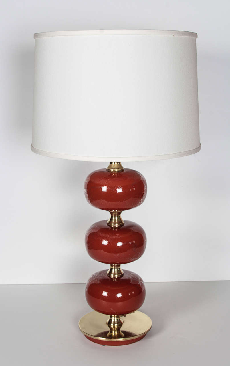 A Pair of AB Stilarmatur Persimmon Glass Orb & Brass Lamps