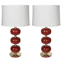 A Pair of AB Stilarmatur Persimmon Glass Orb & Brass Lamps