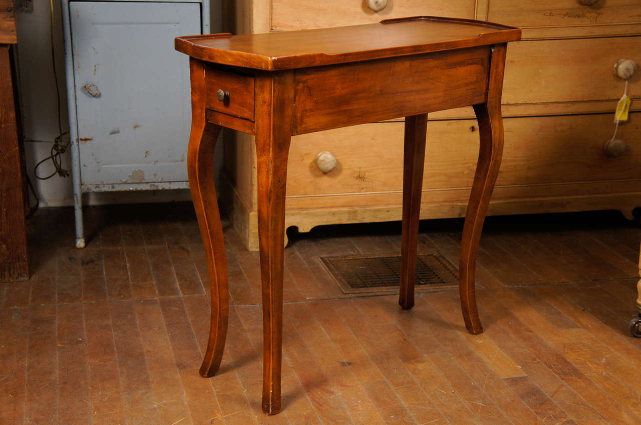 French mahogany  useful small end table with one drawer and Cabriolet legs.  Semi-galleried top.  Nice deep drawer.