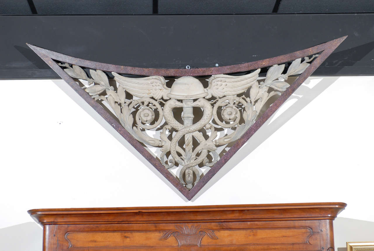 A pair of architectural wall hangings in painted finish. 

