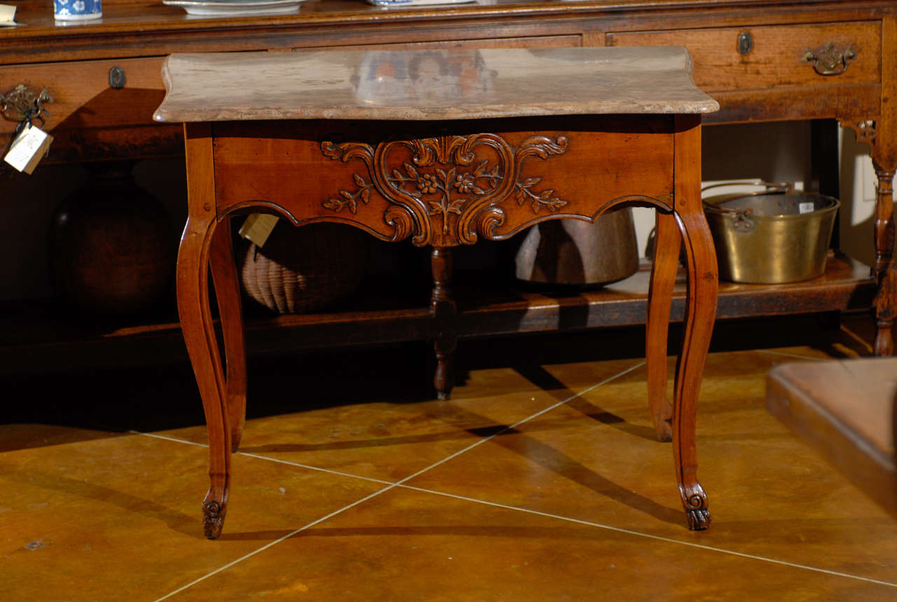 A Louis XV walnut console table with marble top. carved shaped apron with drawer and cabriole feet. 