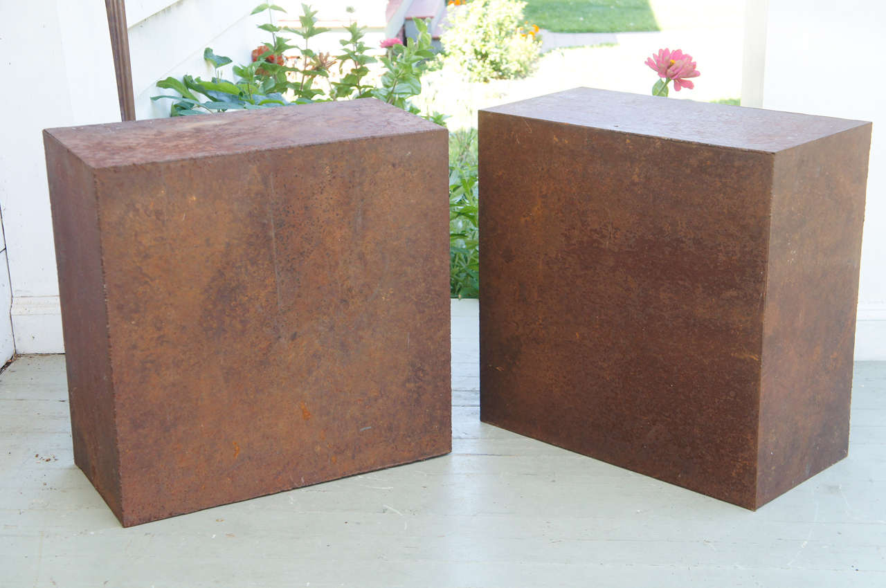 Objects of great distinction. Fabricated from steel with a wonderful rusted patina. An end table or pedestal.