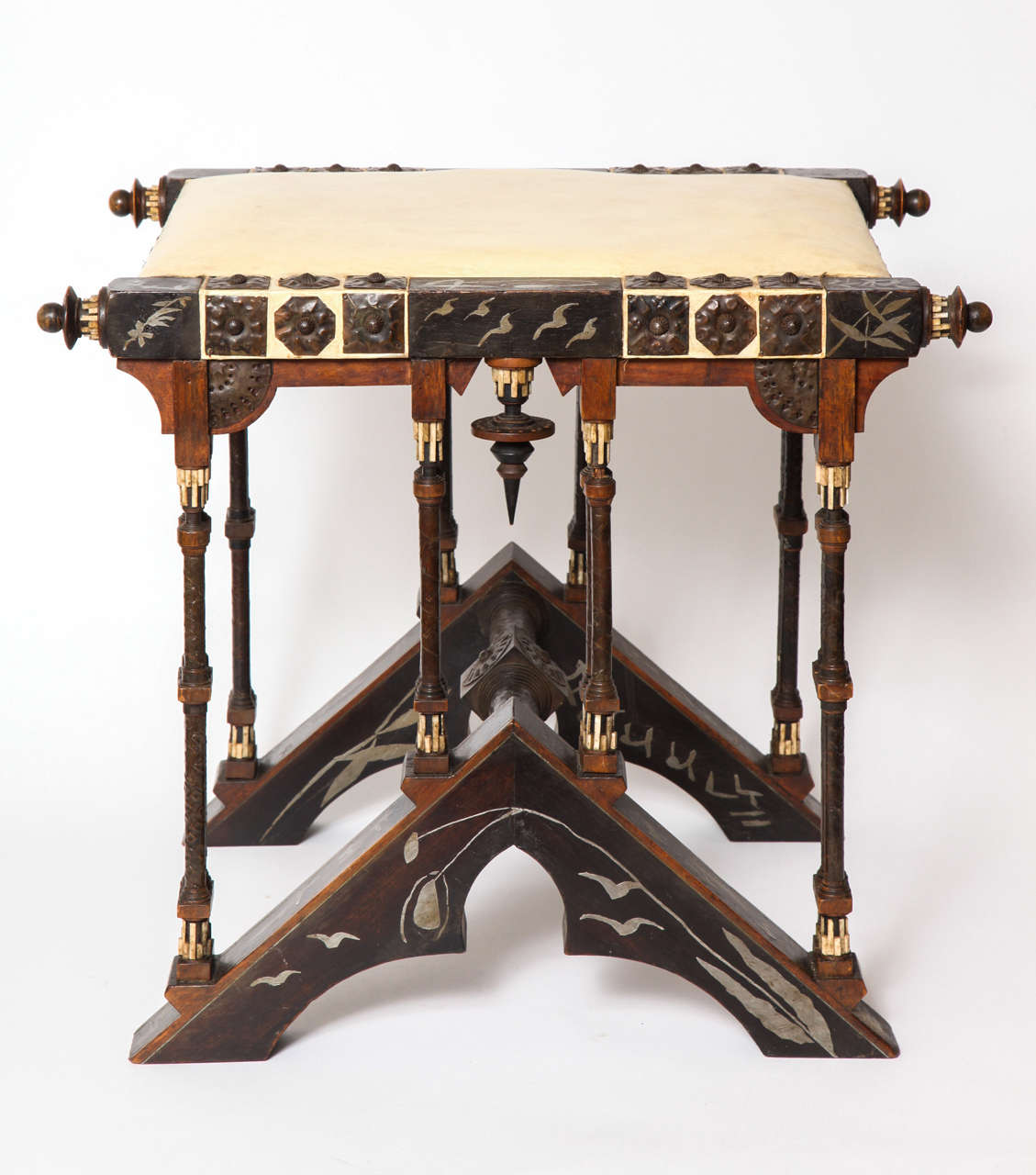 A Carlo Bugatti, Wood, Inlaid Pewter, Hammered Copper, Bone and Leather Stool,made in his Milano Studio, circa 1900