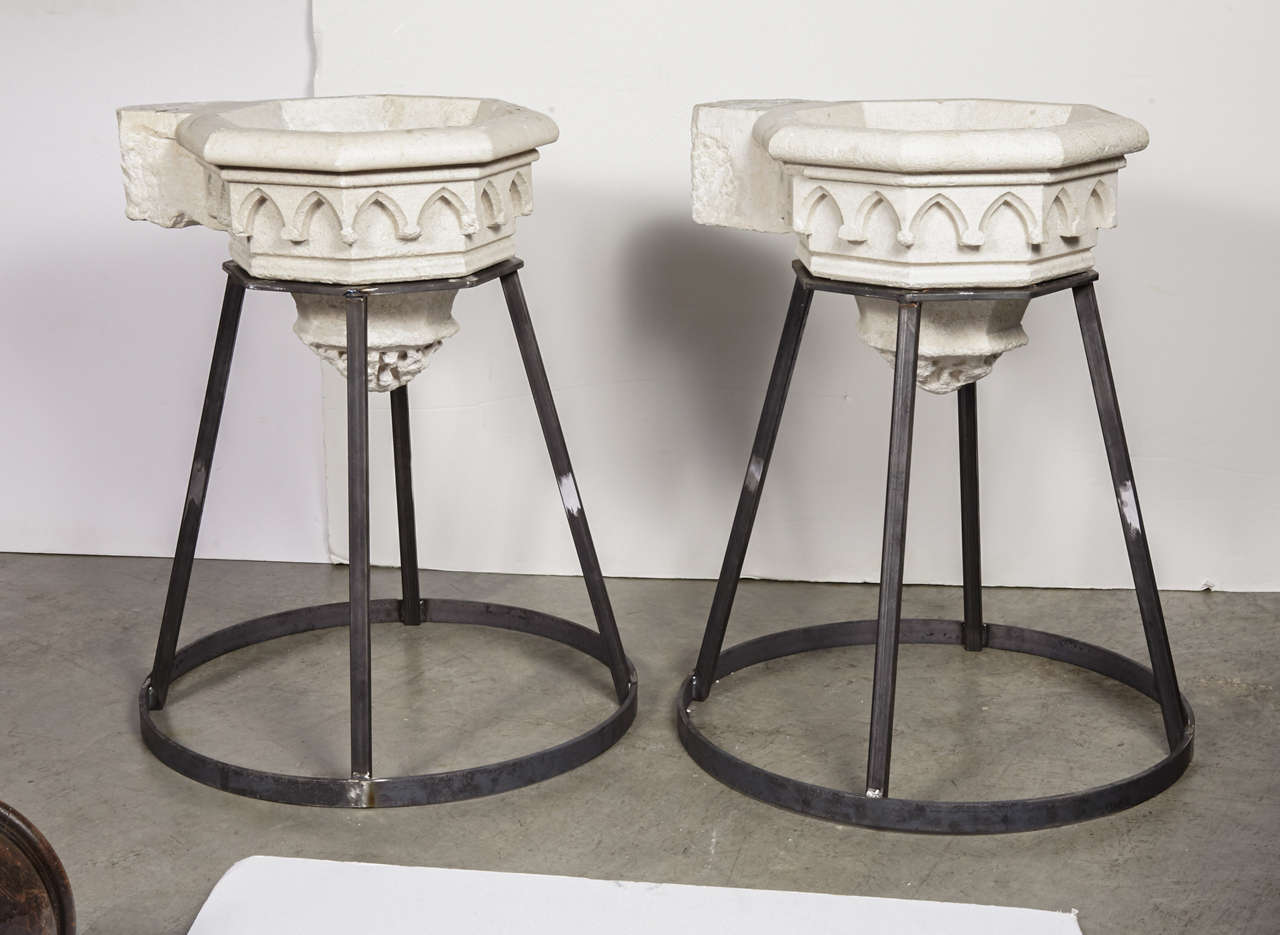 These antique French Gothic style white limestone (Pierre Calcaire) pieces are old holy water vessels (stoups or 'benitiers' in French) are from a small chapel in the Drome department about a 100 KM from Lyon. The basins are octagonal and have