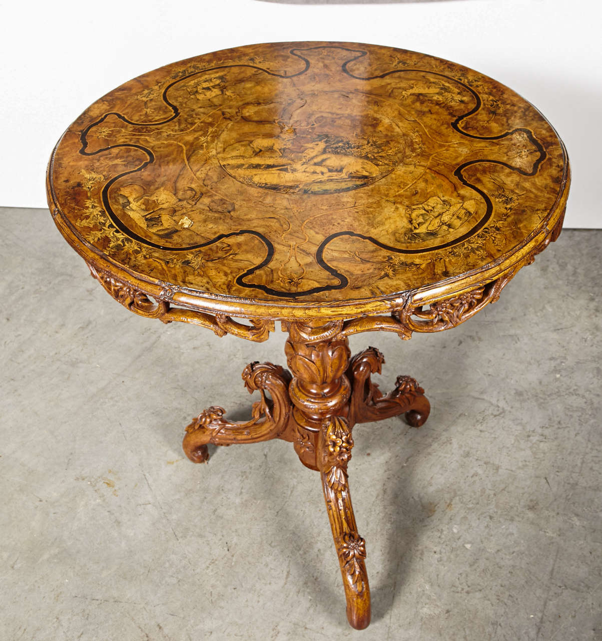 This is an absolutely stunning set featuring an Inlaid Edelweiss Brienz hand-carved tilt-top table with four chairs. The extremely fine details of the Edelweiss flowers as well as the scenes of animals and people of the Brienz area is truly a work