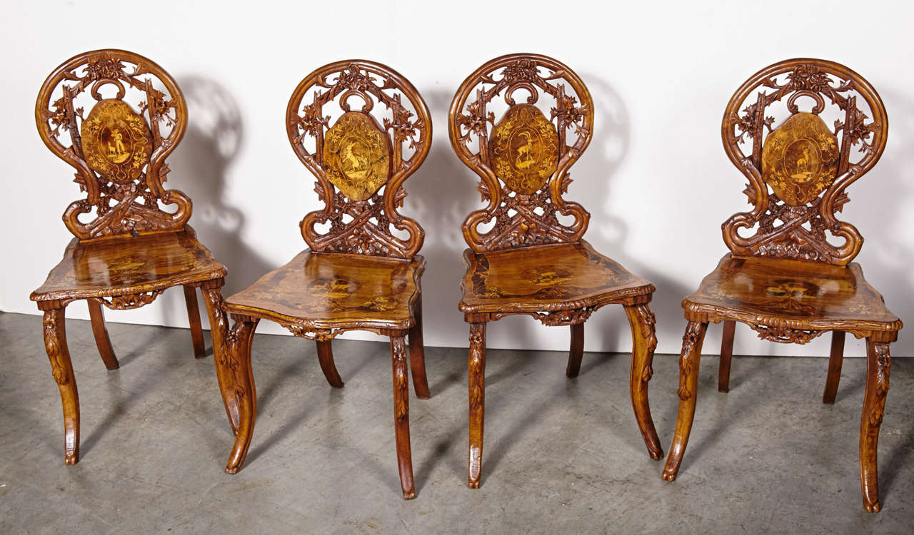 Carved Complete Set of Antique Inlaid Edelweiss Brienz Tilt–Top Table and Four Chairs