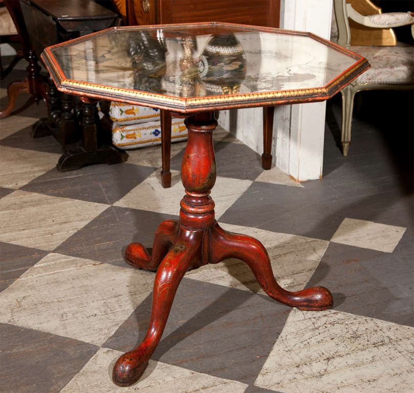 RED LACQUERED CHINOISSERIE DECORATED  TILT TOP TABLE WITH AN OCATAGONAL MIRRORED TOP, DECORATED WITH HAND PAINTED CHINESE FIGURES
