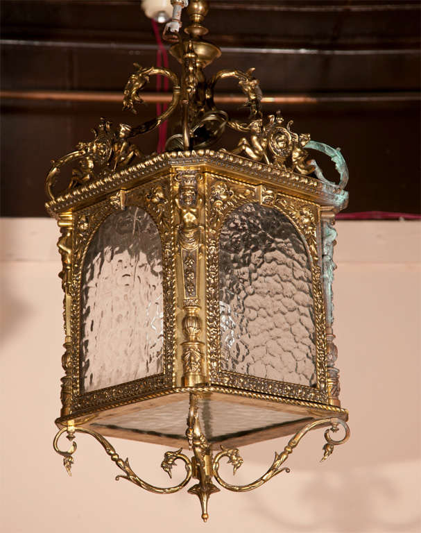 A PAIR OF  SQUARE  HALL LANTERNS WITH RIPPLED  GLASS,  FOLIATE DECORATION, FIGURES AT CORNERS, SWAGS, ELECTRIFIED,  missing   3  panels of  glass

