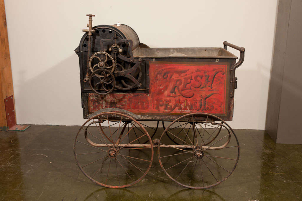 Extremely rare street vendor's peanut roasting wagon.  This vending cart epitomizes the American manufacturing style and ingenuity of the era.  Made by the Bartholomew Company of De Moines Iowa, the original color and lettering are extraordinarily