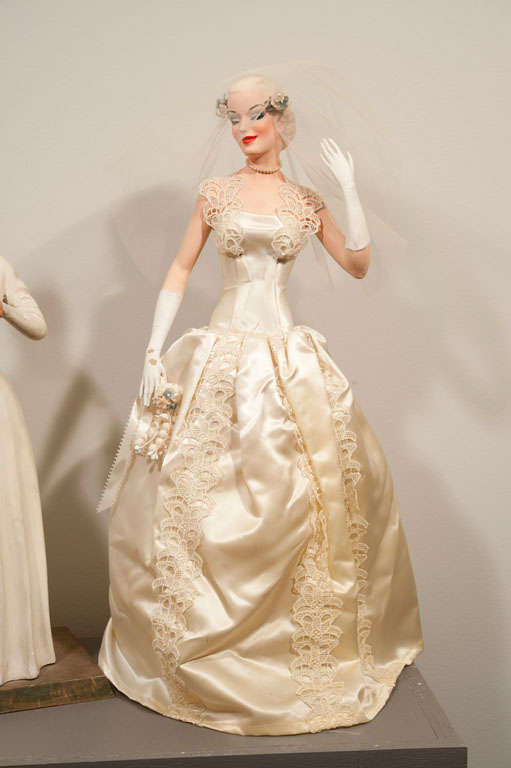 Set of three charming, highly expressive bridal store display dolls
Taller two brides are on stands/bases, matron is a wood carving with fabric headpiece