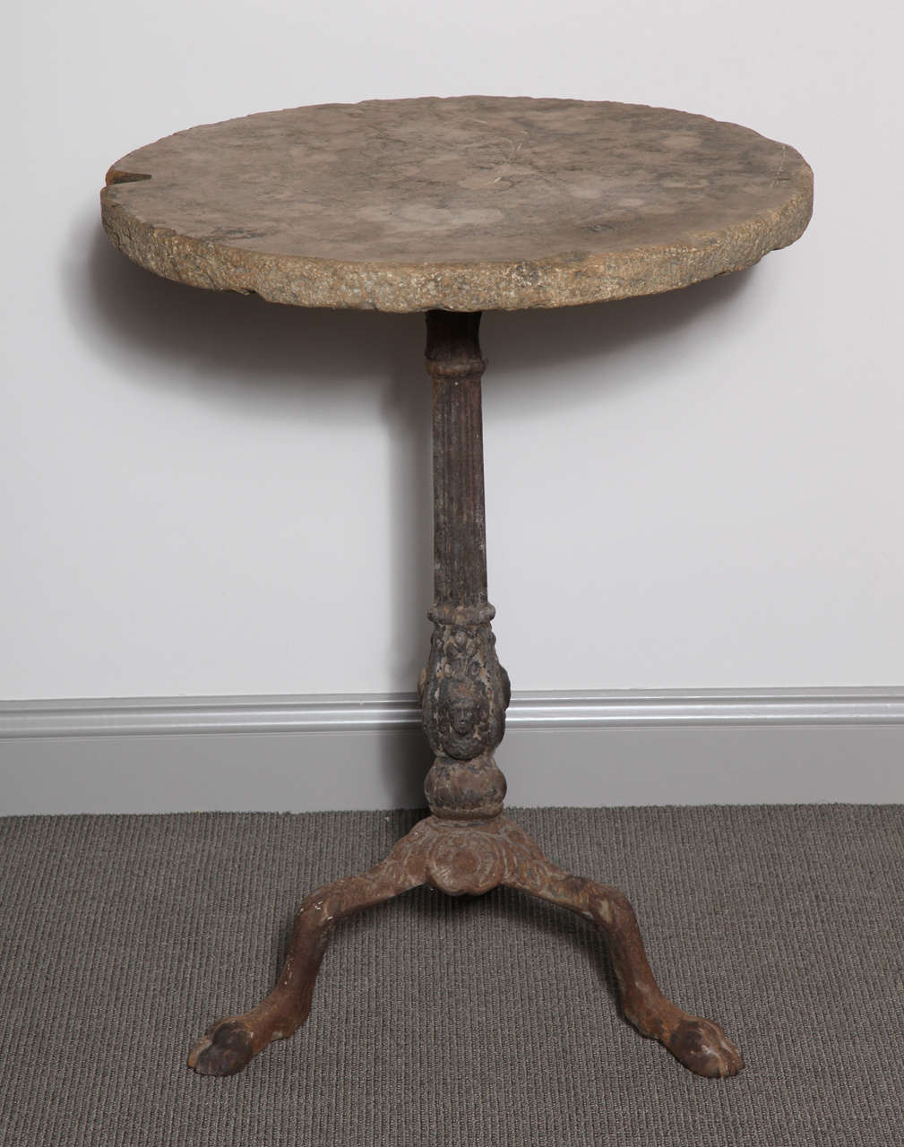Metal base bistro table with stone top.