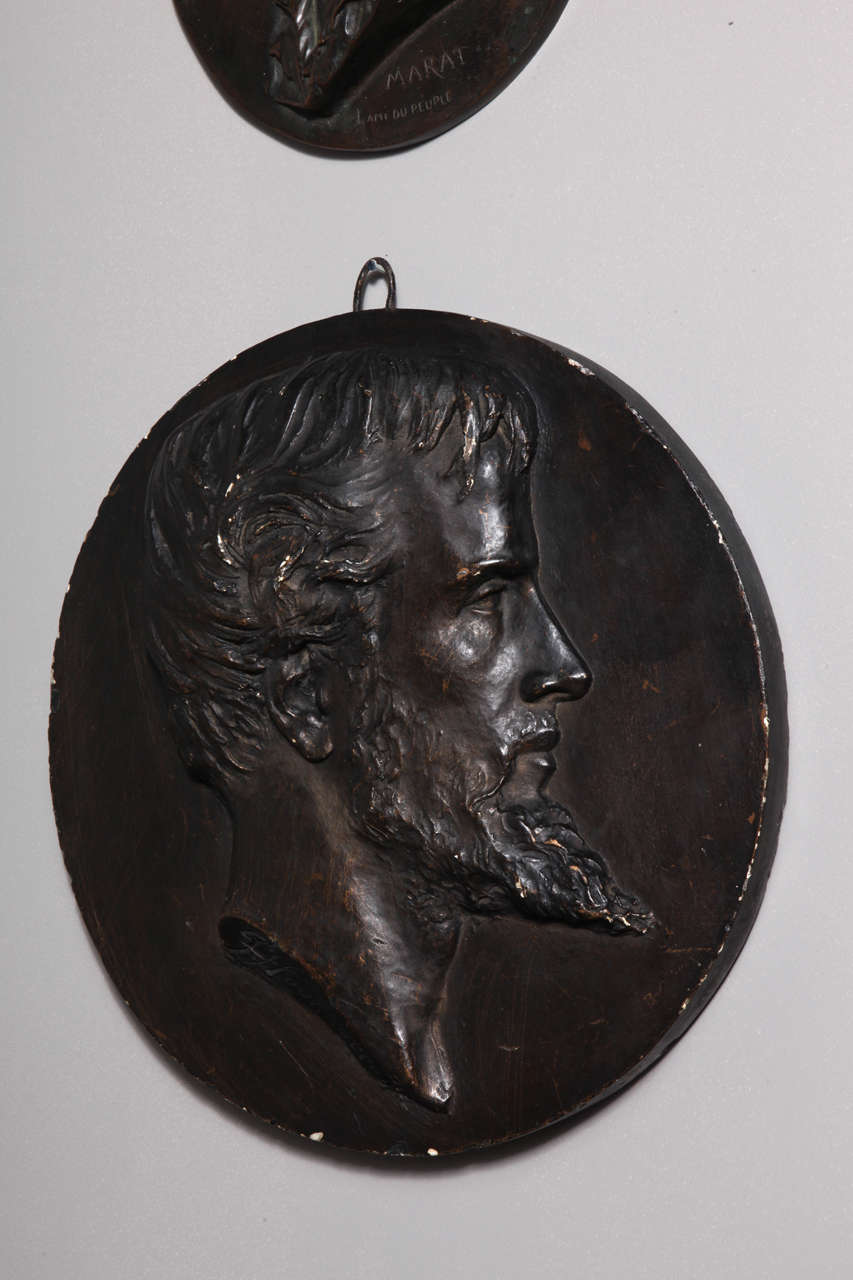 Plaster medal with the image of a man.