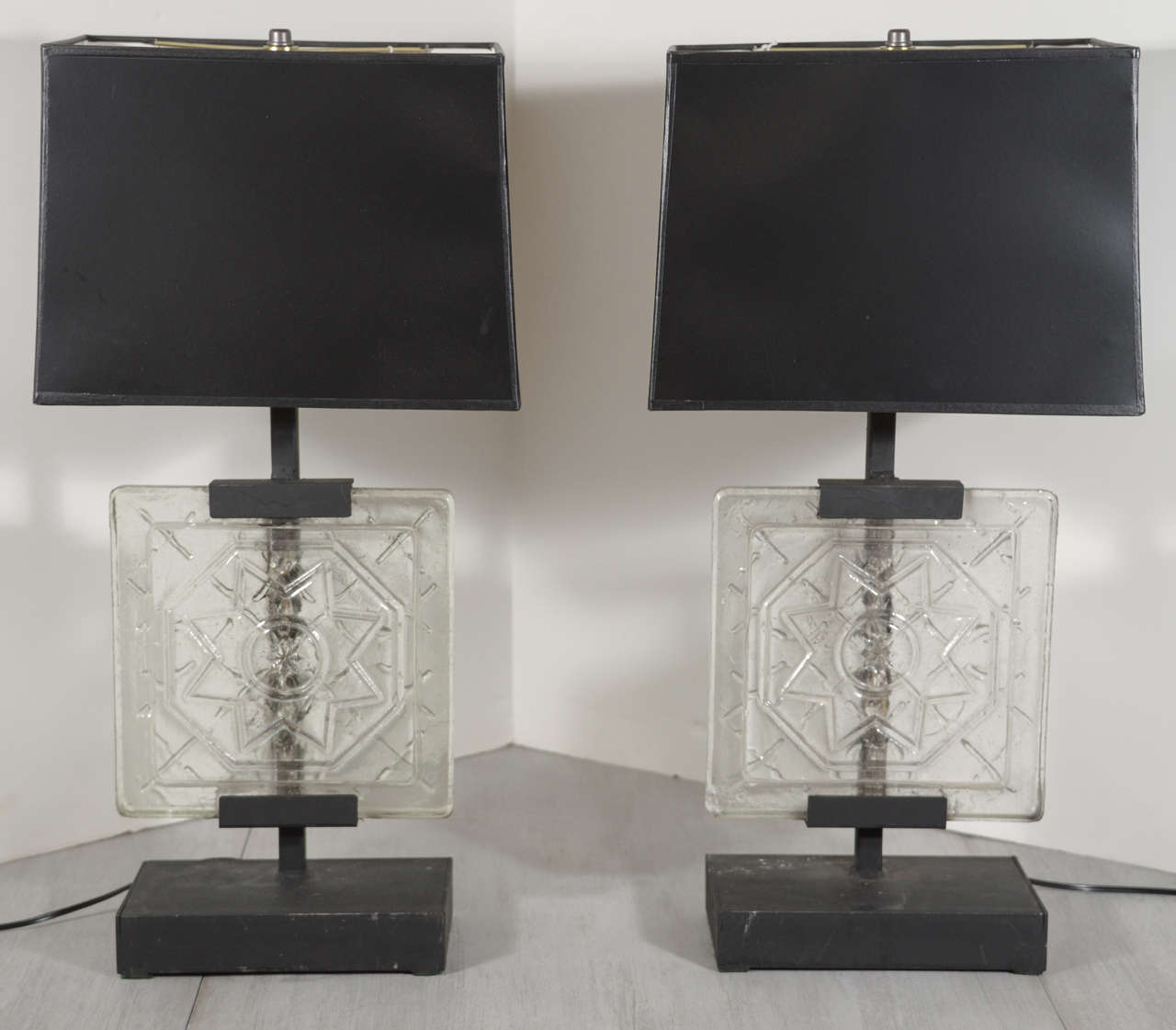 Pair of lamps made with vintage clear glass architectural tile. With custom, heavy steel bases. Black paper shades as shown (measures: 9 x 13 x 9-1/2 H) are included.