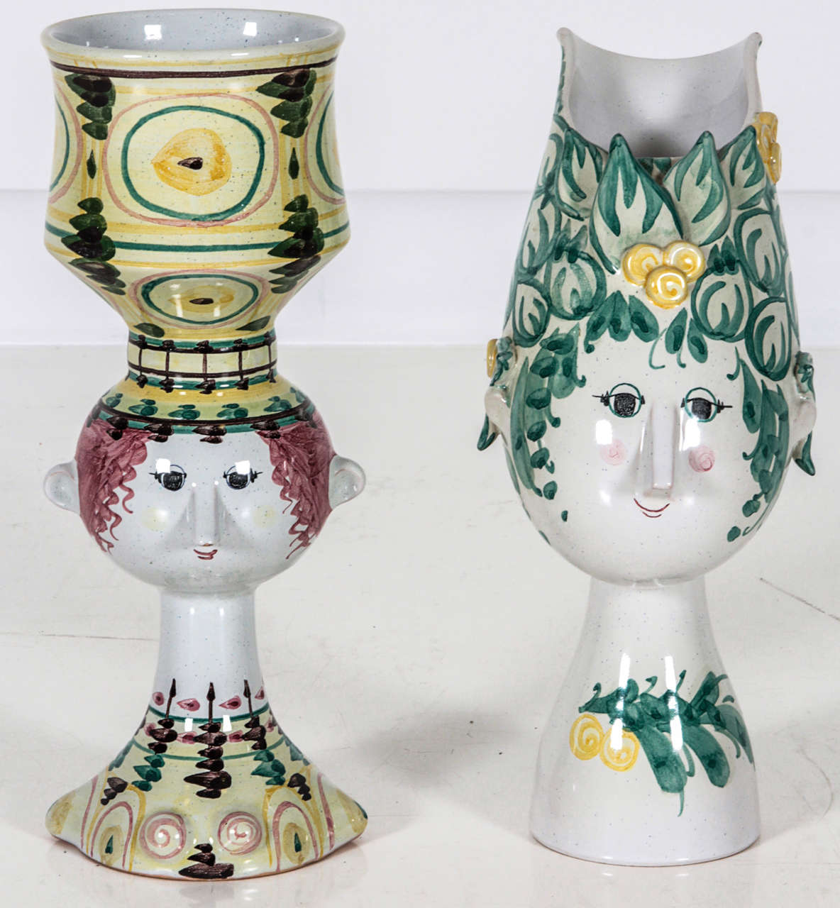 Fantastic hand-painted ceramic bust vessels by famed Danish artist Bjorn Winblad. $1200 each, but make a great statement when paired together.

Left figure measure 12