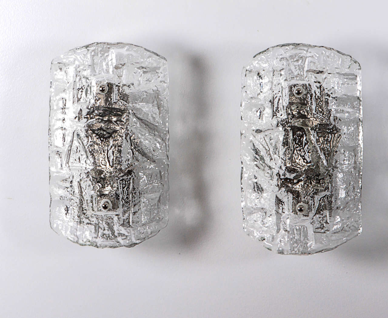 Fantastic pair of deep cut ice crystal sconces by Kosta Boda. Rewired for use in the USA.