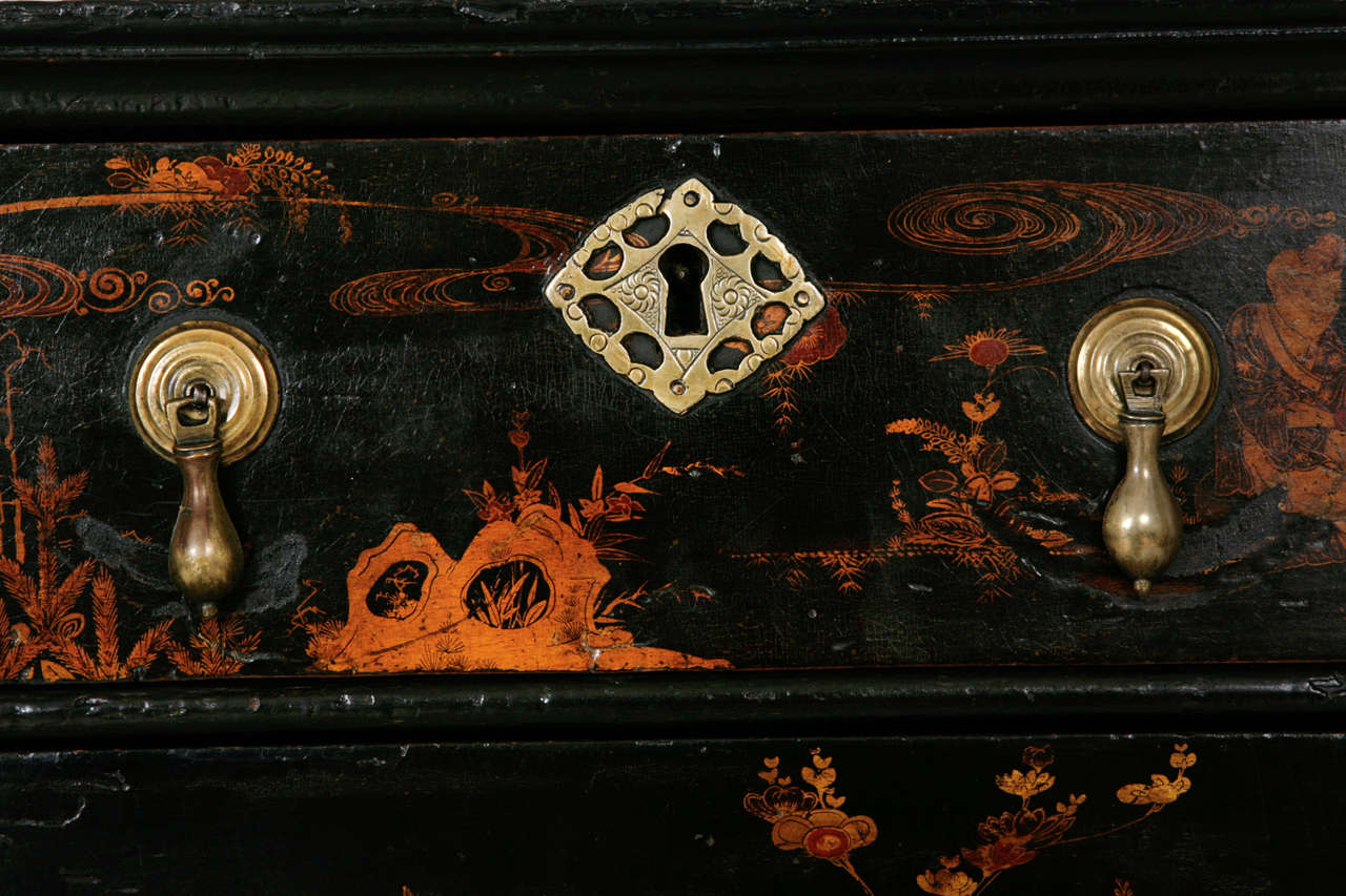 A very rare and finely decorated Queen Ann black lacquer, Chinese chinoiserie chest.  Decorated on all surfaces with superb and deftly painted scenes of Chinese life, the chinoiserie is of the highest quality having been created by a Chinese