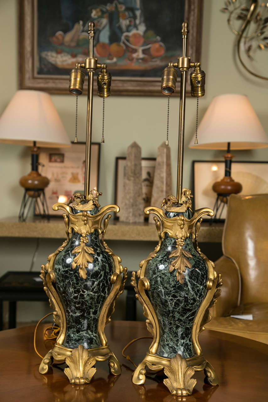 A pair of French bronze and marble table lamps, circa 1800s.