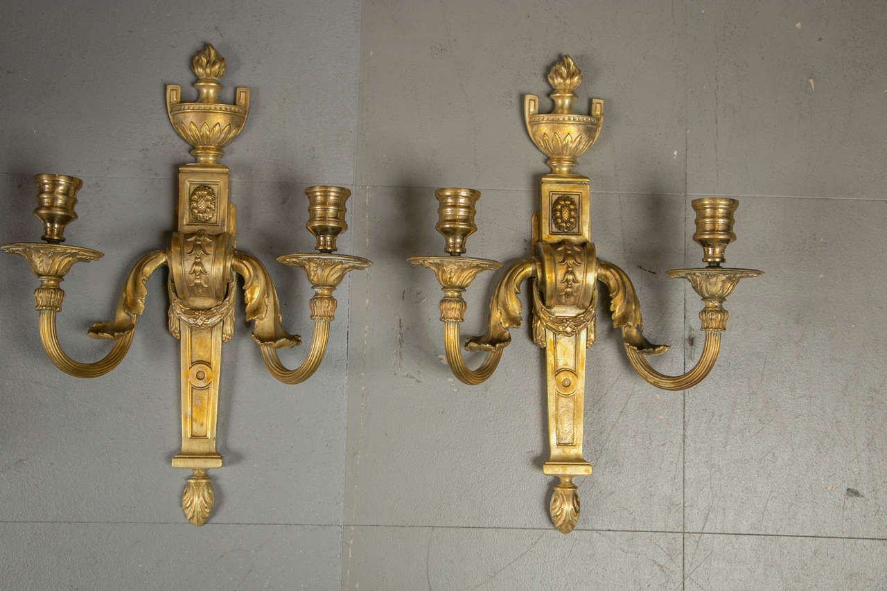 A beautiful pair of neoclassical style Caldwell gilt bronze sconces, circa 1910.