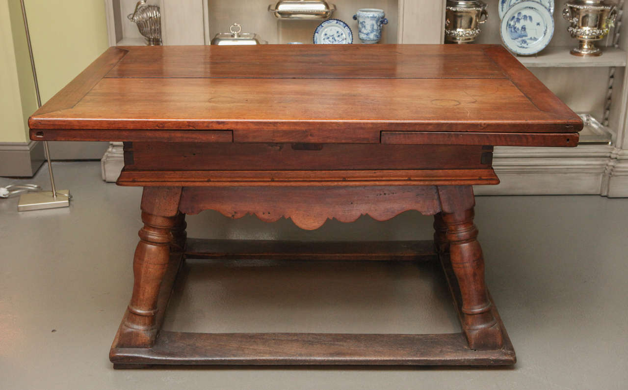 An American or continental carved mahogany tavern table, 18th century. Measures: Closed width is 52.25