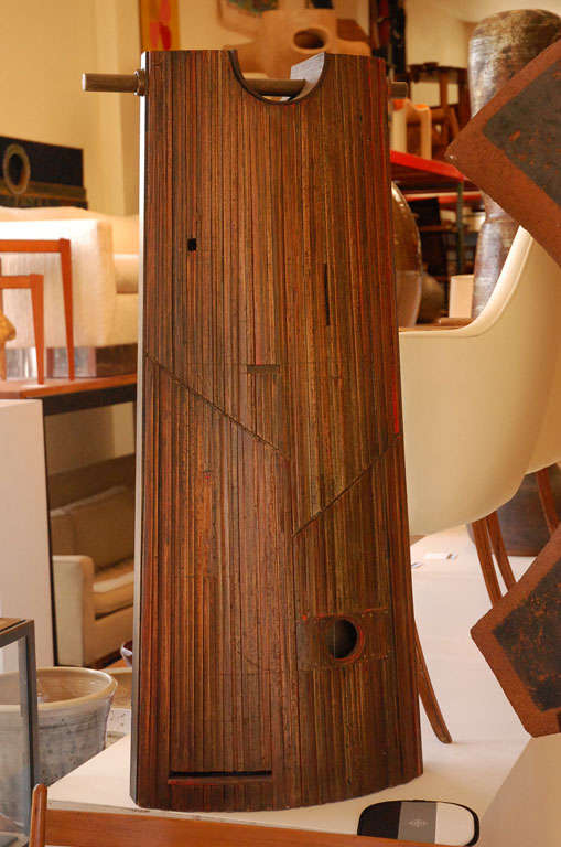 Hand crafted wood assemblage sculpture with added patina by California artist and furniture designer John Kapel. Well known for his furniture designs for Glenn of California, John Kapel also does sculpture, jewelry design and painting.